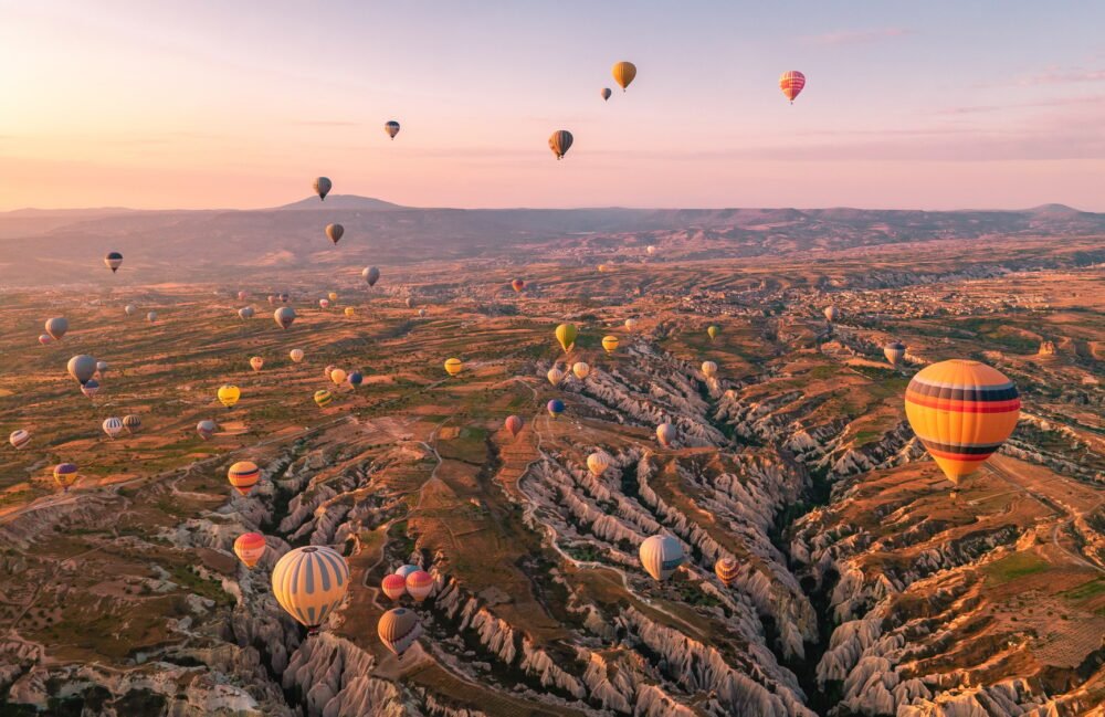 Cappadocia Turkey sunrise in the hills with hot air balloons, Kapadokya Turkey Goreme