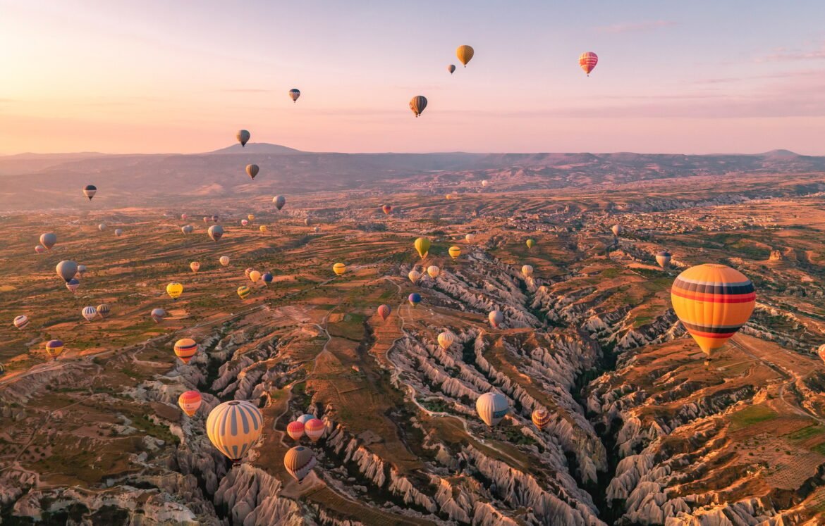 Cappadocia Turkey sunrise in the hills with hot air balloons, Kapadokya Turkey Goreme
