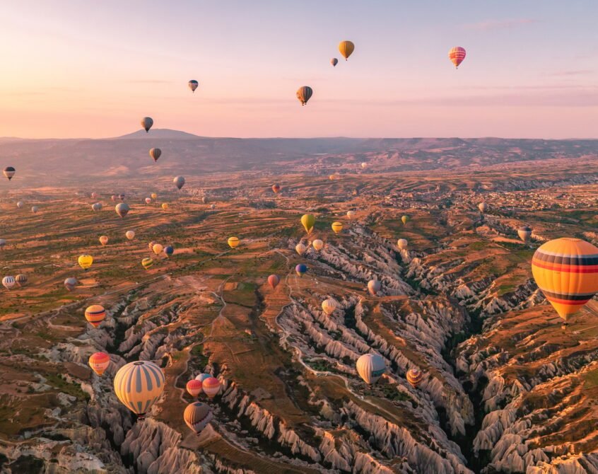 Cappadocia Turkey sunrise in the hills with hot air balloons, Kapadokya Turkey Goreme